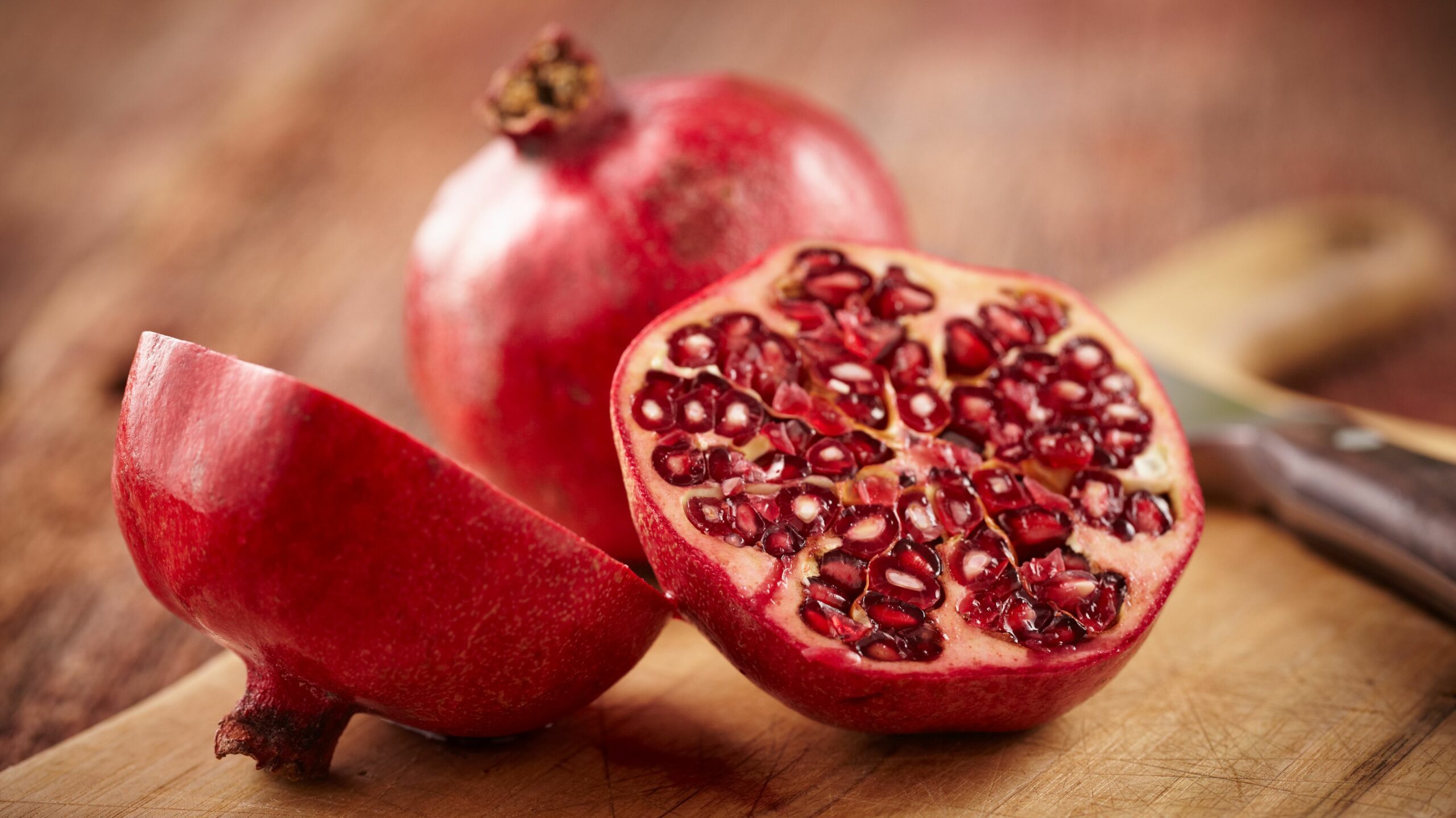 pomegranate-fruit-on-cut-board