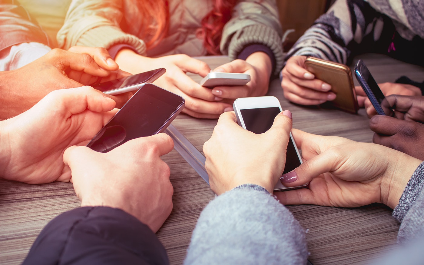 hands holding phones