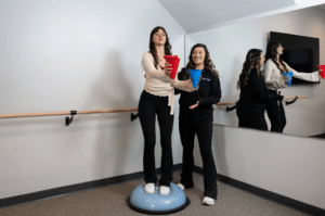 Patient performing a home exercise program after completing pelvic floor physical therapy at a wellness clinic in Philadelphia, PA